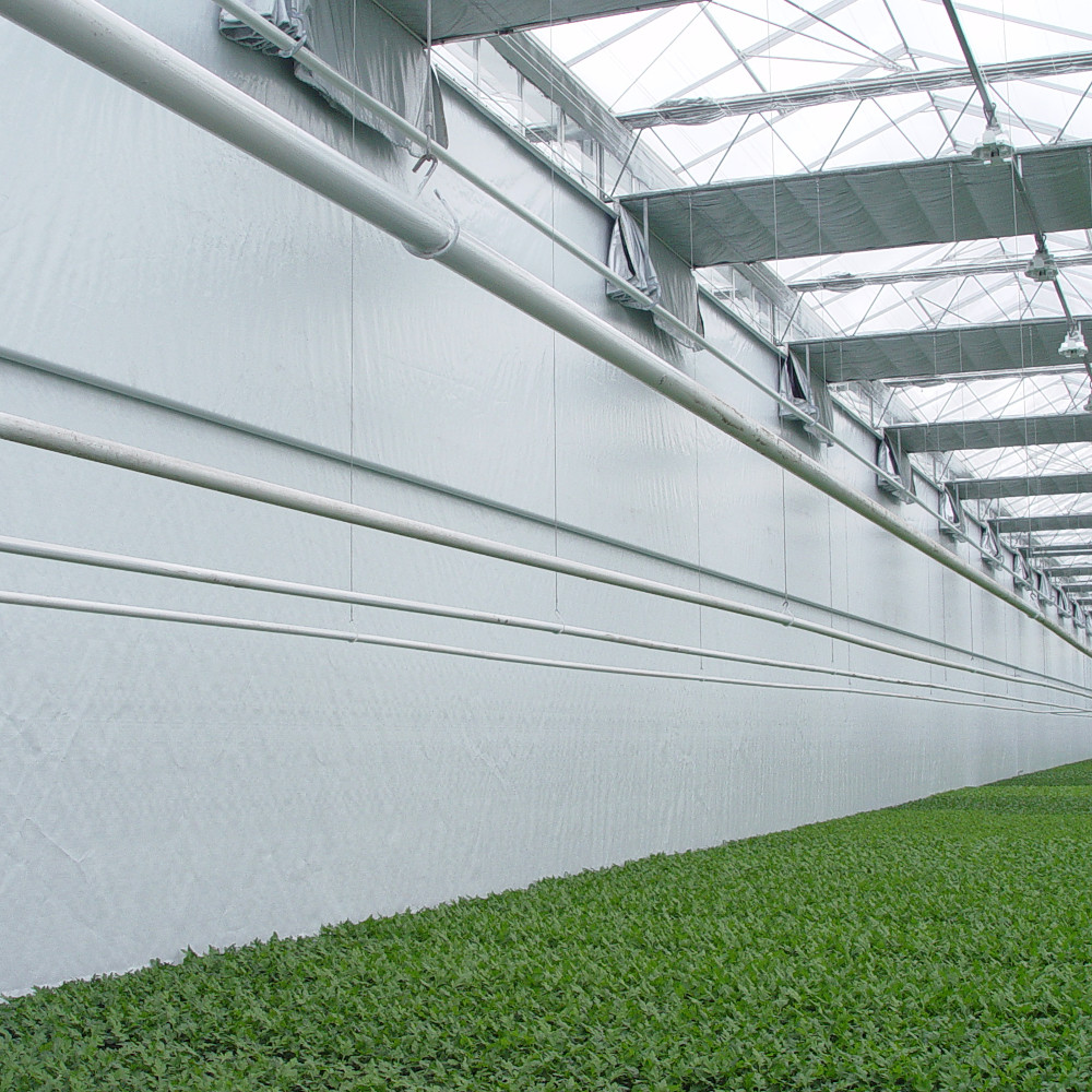 Vertical screen cloth Vertical screen cloth for use at the gable of the greenhouse or side skirts.